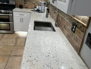Essential Granite team performing granite countertop installation near Powder Springs, GA.